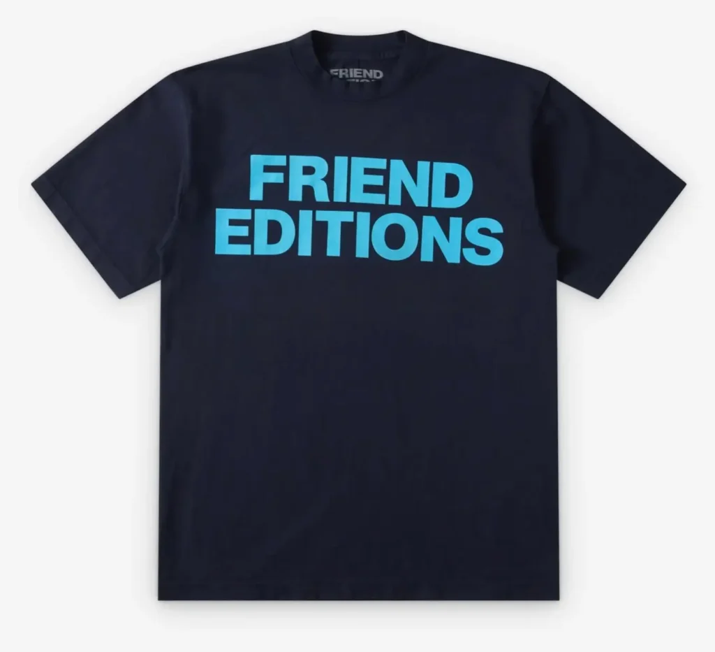 Navy Friend Editions logo T-shirt featuring oversized bright-blue block typography across the chest with a minimalist short-sleeve silhouette and clean contemporary streetwear style