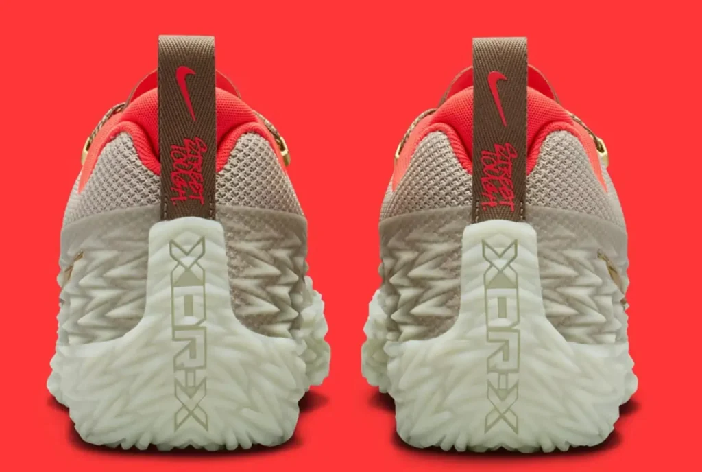Rear view of the Nike ST Charge “College Grey” basketball shoe shown as a pair, highlighting the sculpted translucent heel structure, textured grey mesh upper, bright crimson collar lining, brown pull tabs with red Nike branding, and oversized XDR-X heel graphic