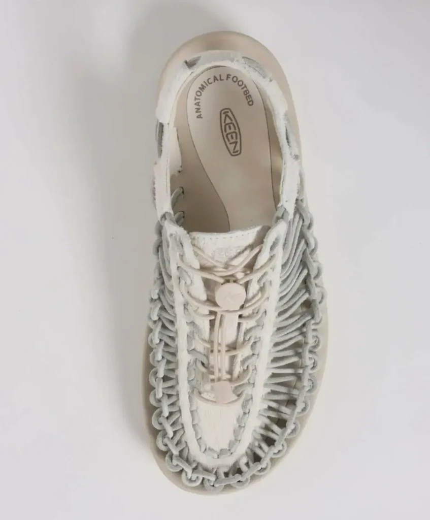 Top-down view of the KEEN woven slingback sandal emphasizing the anatomical footbed, intricate cord webbing, elastic lace system, and open breathable construction