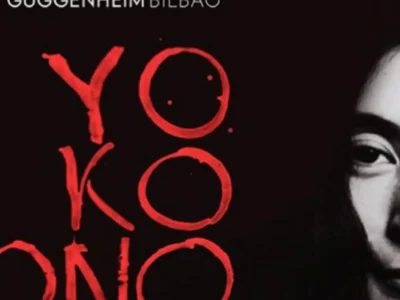 Promotional graphic for the Guggenheim Museum Bilbao featuring a dark black background, bold red hand-painted typography spelling “Yoko Ono,” and a monochrome close-up portrait of Yoko Ono partially visible on the right side, creating a striking and minimalist exhibition announcement