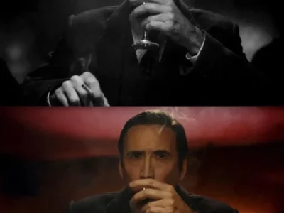 Split-screen comparison from Spider-Noir featuring Nicolas Cage seated in a smoky nightclub or lounge. The top half is presented in dramatic black-and-white noir style, emphasizing deep shadows, cigarette smoke, and vintage detective-film aesthetics. The bottom half shows the same scene in color, with warm red and amber lighting illuminating Cage as he holds a drink and a cigarette, highlighting the contrast between the series’ optional monochrome and color presentations