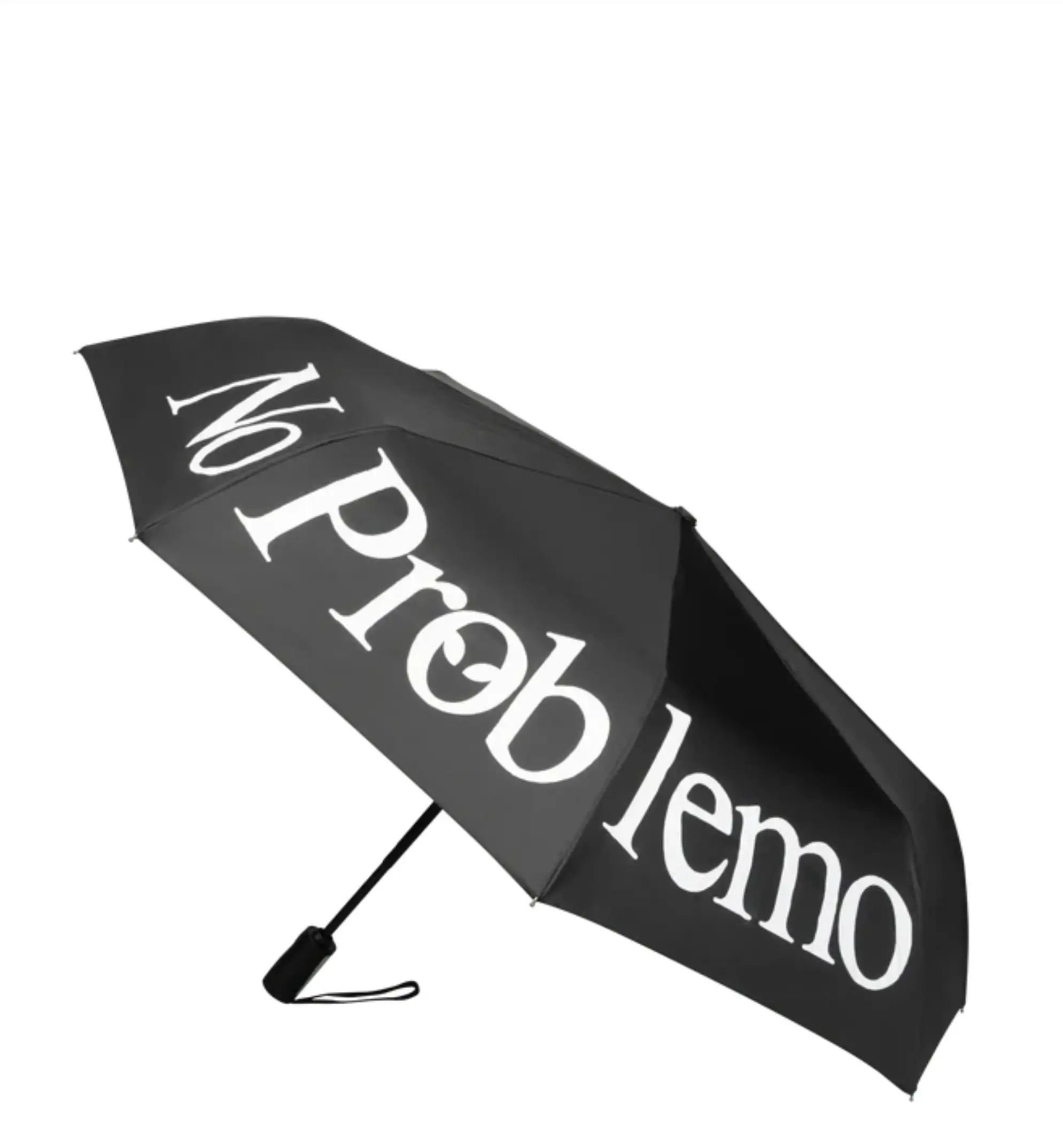 Black No Problemo umbrella featuring oversized white logo typography across the canopy with a compact folding design and wrist strap handle