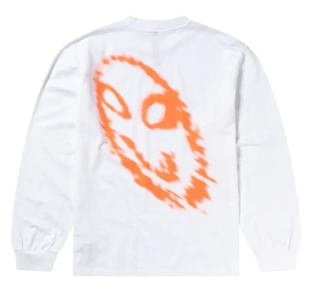 White long-sleeve T-shirt featuring a large abstract neon-orange ghost-like face graphic printed across the back, presented in a minimalist studio product shot against a light-gray background