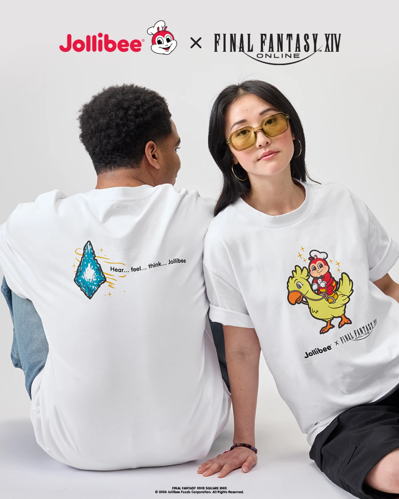Lifestyle campaign image of models wearing white Jollibee x FINAL FANTASY XIV graphic tees featuring chocobo artwork and blue crystal-inspired back graphics