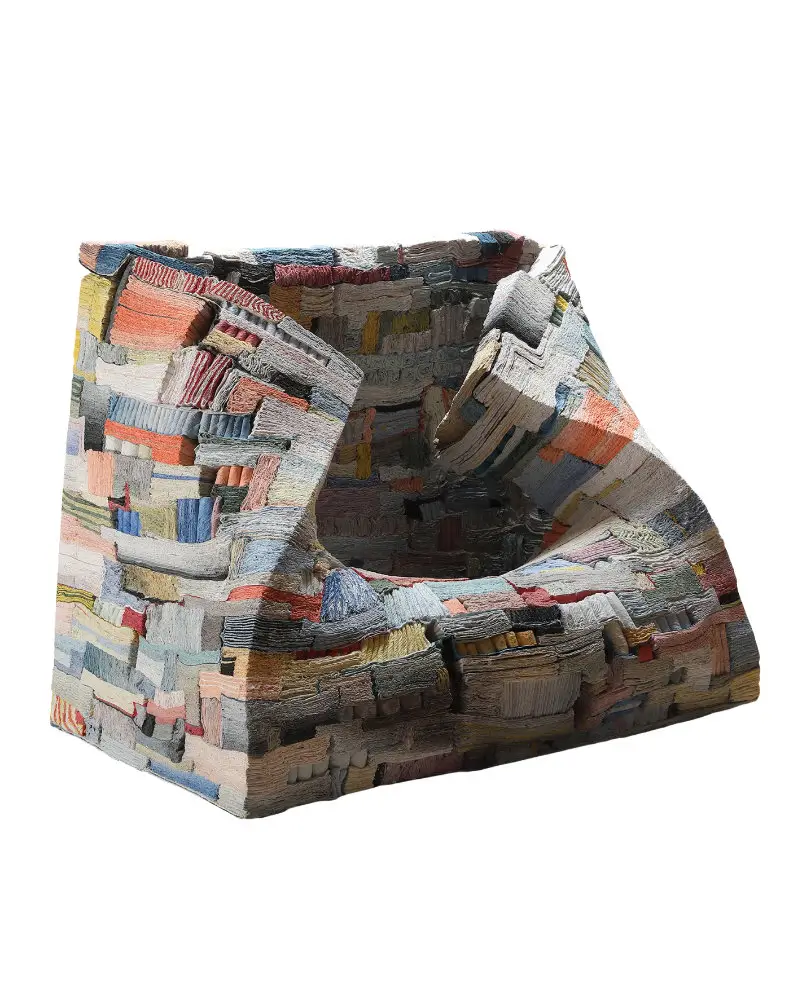 Strata of Illusion (2025) by Jongjin Park, the winning work of the 2026 LOEWE FOUNDATION Craft Prize, featuring a layered ceramic structure composed of densely compressed, paper-like strata in muted pastel and earth-toned pigments against a minimalist studio backdrop