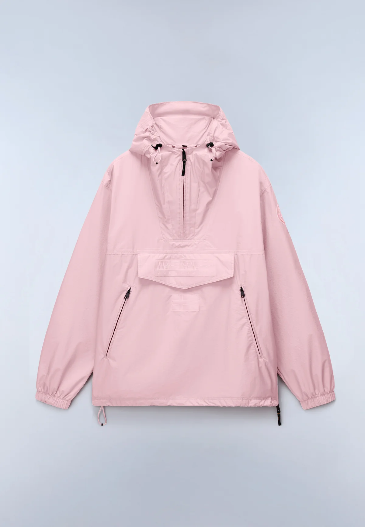 Soft pink Napapijri Rainforest Anorak shown against a minimal studio backdrop, featuring a lightweight technical shell, adjustable hood, signature front flap pocket, and clean utility detailing