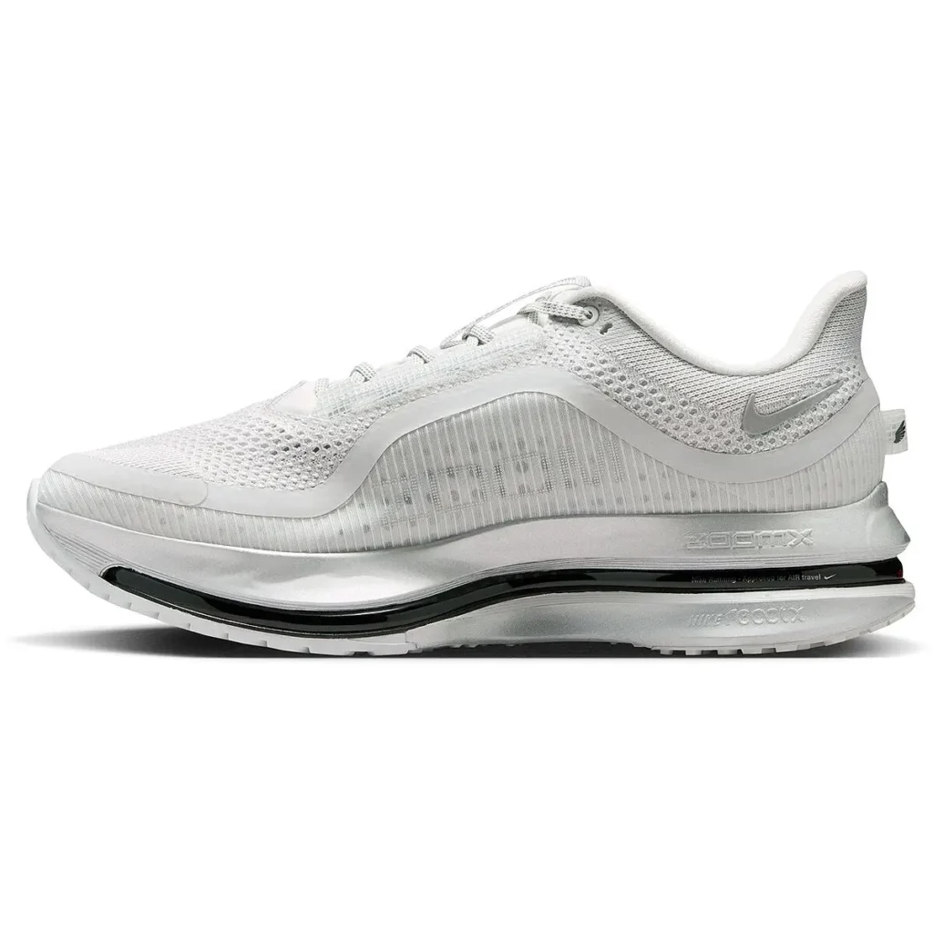 Full lateral profile of the white Nike Pegasus Premium running shoe featuring a lightweight engineered mesh upper, translucent ribbed sidewall detailing, and tonal overlay construction. The silhouette is anchored by a sculpted white midsole with layered foam and a full-length visible black Air Zoom cushioning unit, while subtle silver Swoosh branding and streamlined proportions reinforce its premium, high-performance running identity