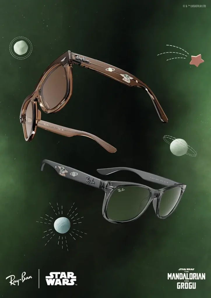 A dual-frame campaign view from the Ray-Ban x Star Wars: The Mandalorian and Grogu collection presents two translucent lifestyle silhouettes floating through a glowing emerald galaxy backdrop filled with illustrated planets and celestial graphics. The upper pair arrives in a smoky amber-brown finish with warm tinted lenses, while the lower frame adopts a cooler translucent charcoal-grey construction paired with green-tinted optics. Both designs feature subtle Grogu illustrations and tiny orbital motifs printed along the temples, blending playful character-driven storytelling with classic Ray-Ban eyewear styling. The composition balances collectible pop-culture nostalgia with contemporary fashion minimalism, transforming the sunglasses into wearable sci-fi accessories that feel equally rooted in luxury design and animated galactic fantasy
