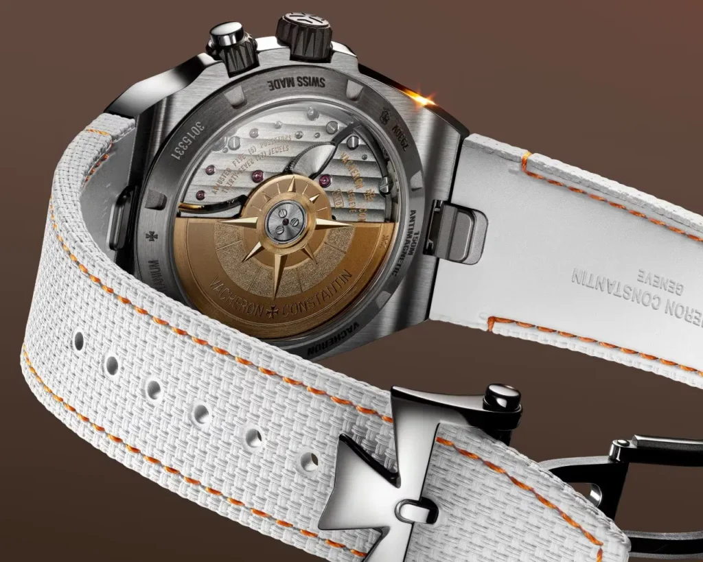 Titanium caseback with golden compass rotor, visible Cal. 5110. Antimagnetic & refined