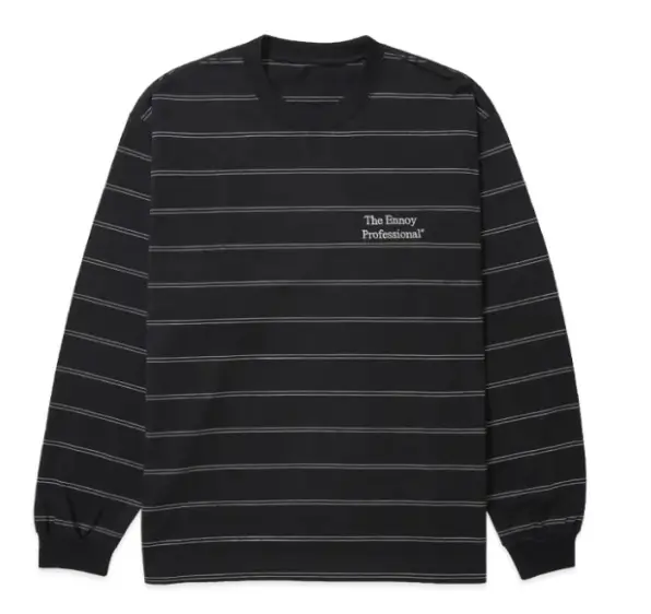 The Ennoy Professional® long-sleeve striped tee in black, designed with fine horizontal contrast lines and understated chest logo embroidery. The relaxed silhouette, ribbed crewneck, and minimal graphic treatment reflect Ennoy’s signature balance of quiet Japanese utility, elevated basics, and everyday uniform dressing