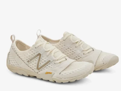 New Balance MT10 Linen Timber Wolf trail runner shown in a three-quarter angle, highlighting the breathable honeycomb mesh upper, soft suede overlays, tonal beige N logo, and minimalist Vibram-equipped sole in a monochromatic earth-toned palett