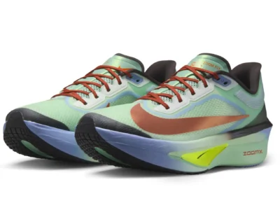 Angled pair shot of the Nike Zoom Fly 6 in mint green with metallic copper detailing, red laces, pale blue midsole accents, and a neon yellow Flyplate insert designed for speed-focused running