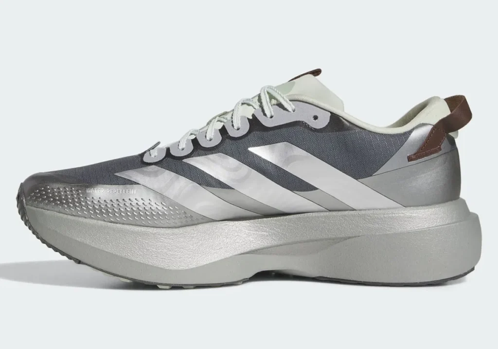 Side profile view of the adidas Star Wars Mandalorian & Grogu Adizero EVO SL ATR highlighting the sculpted Lightstrike Pro midsole, water-repellent ripstop upper, reflective Three Stripes branding, and muted Mandalorian-inspired grey and silver color blocking