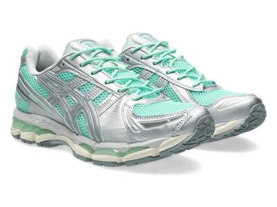 Angled product shot of the ASICS GEL-Kayano 12.1 “Ice Green,” showcasing breathable mint mesh, reflective silver armor-like overlays, sculpted sidewall detailing, translucent green GEL pods, and an off-white midsole