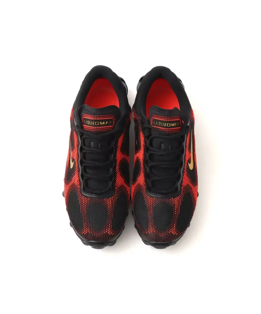 Top-down product image of the Nike Air Liquid Max displaying the dynamic woven upper pattern, black lacing system, red interior lining, and Liquid Max tongue brand