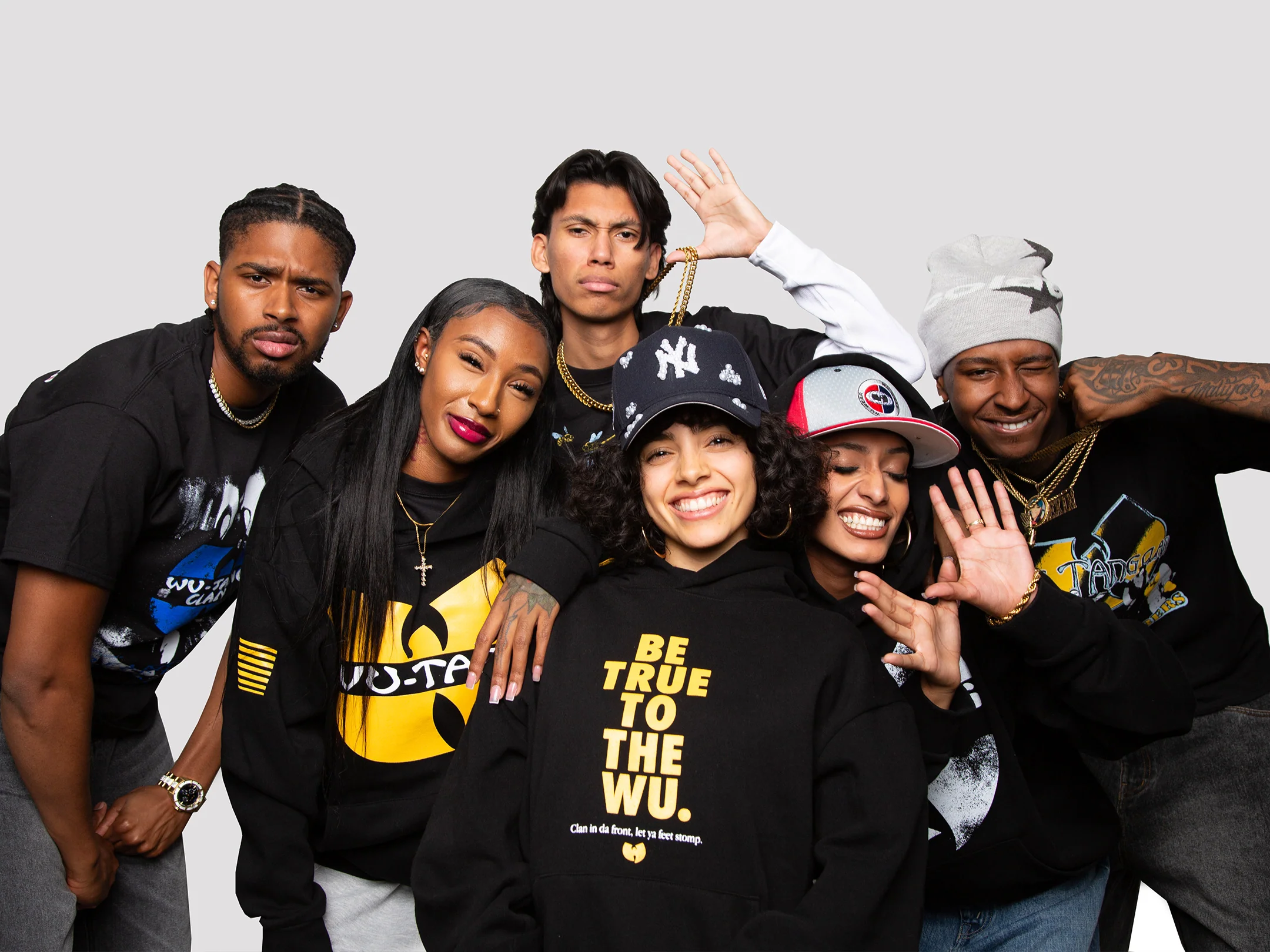Wu-Tang Clan Fans Representing – Real fans rocking the latest official merch (hoodies, tees, and caps) that will be available at the 2026 C.R.E.A.M. pop-up events across the U.S