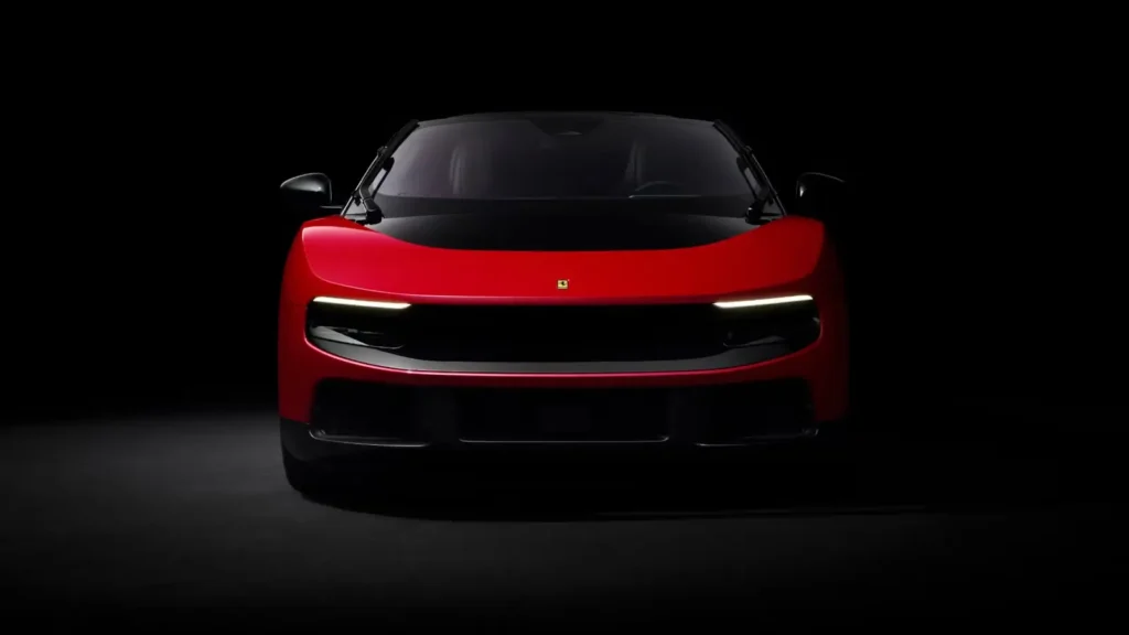 Studio front view of a bright red futuristic electric grand tourer against a black backdrop, featuring ultra-thin horizontal LED daytime running lights, a seamless gloss-black front panel, smooth sculpted surfaces, a panoramic glass canopy, and a minimalist performance-focused design language