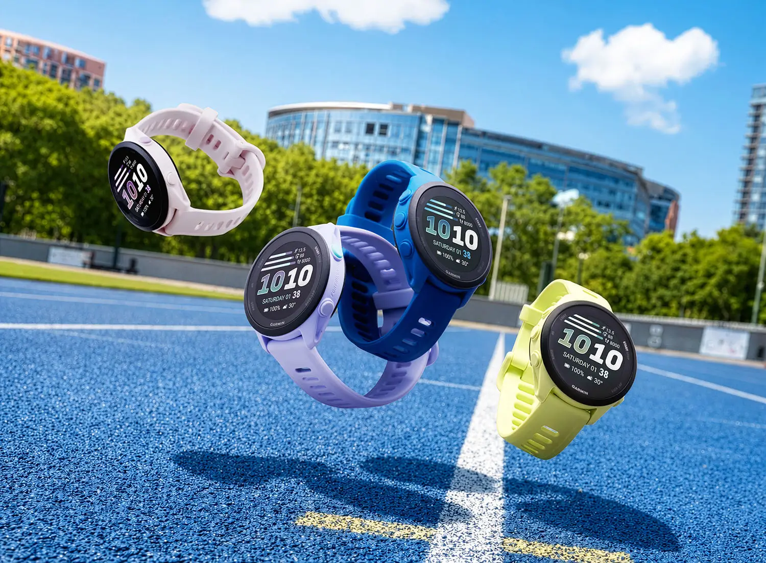 Four Garmin Forerunner smartwatches in pastel pink, lavender, blue, and neon yellow float above a bright blue running track, highlighting lightweight sporty straps, circular AMOLED displays, and vibrant beginner-friendly fitness styling against a sunny outdoor athletic backdrop