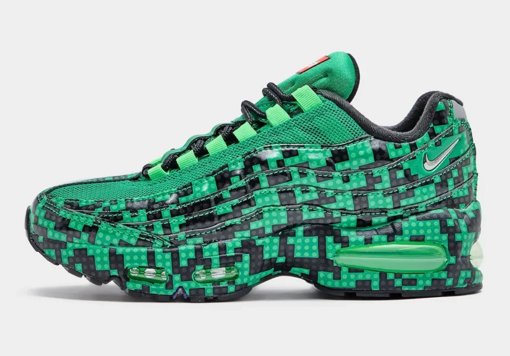 Side profile of the LEGO x Nike Air Max 95 “Lucky Green” showcasing the full brick-print overlay across the signature wavy panels, bright green mesh upper, black outsole accents, and exposed Max Air unit