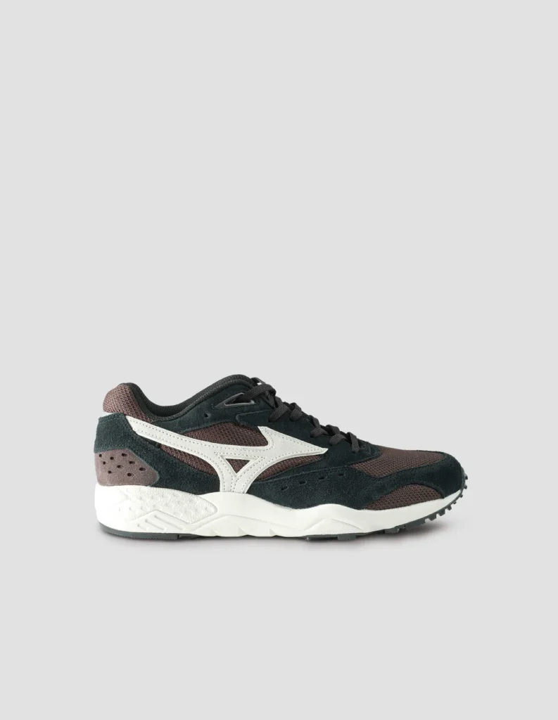 Classic side profile showcasing the sleek silhouette, bold white Mizuno RunBird logo, and premium suede/mesh paneling. Low-profile training design with refined details