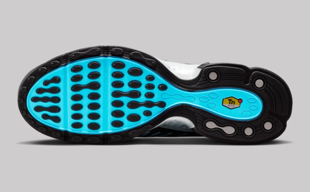 Outsole view of Nike Air Max Plus VII “Scorpion” featuring bright blue rubber base with black traction pods, wave-like grip pattern, and TN Air logo badge at the midfoot