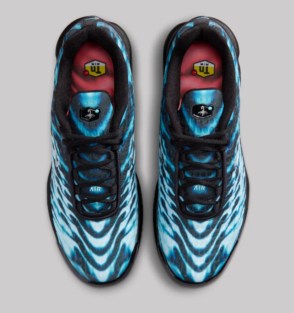 Top-down view of Nike Air Max Plus VII “Scorpion” shoe showing electric blue and black wave-patterned uppers, black laces, tongue badges with scorpion emblem, and red insoles featuring TN Air logos