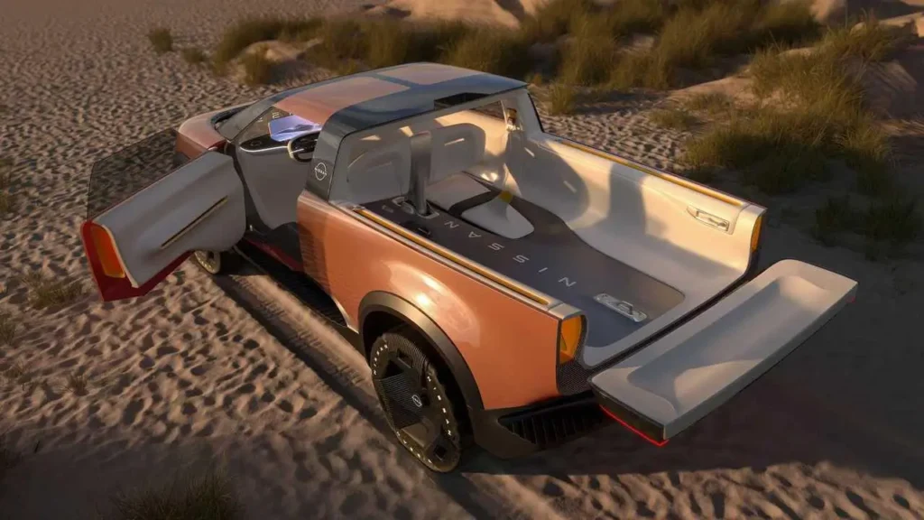 Rear overhead view of the Nissan Surf-Out Concept with coach-style door open and tailgate folded down, revealing an open multifunction cargo bed and seamless cabin-to-bed layout designed for outdoor