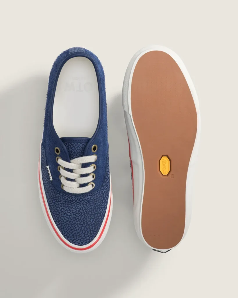 Top-down view of the navy blue Vans OTW Authentic 44 Siped Vibram showcasing textured leather panels, cream rope laces, brass eyelets, and a Vibram outsole engineered for enhanced grip