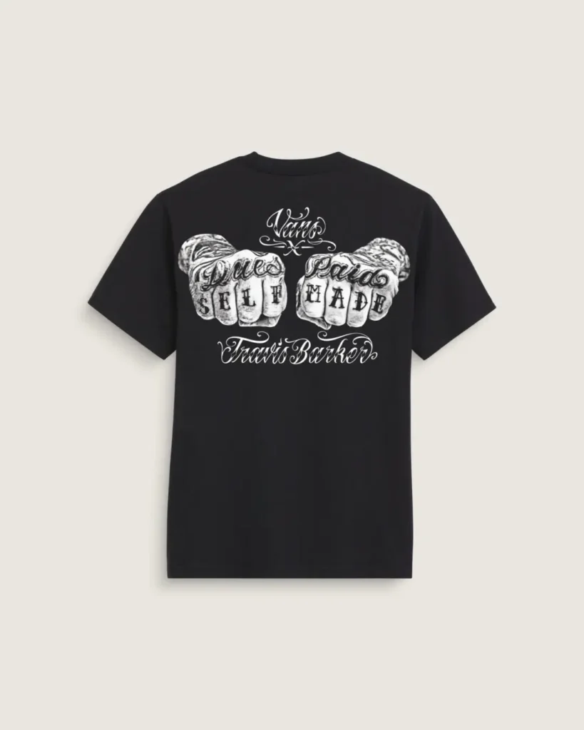 Rear view of the black T-shirt featuring large tattoo-inspired fist artwork and “Dues Paid Self Made” graphic
