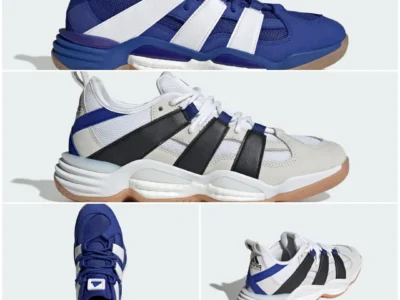 Adidas Equipment basketball shoe in royal blue with oversized white Three Stripes, mesh upper, Boost cushioning windows, and gum rubber outsole shown in side profile