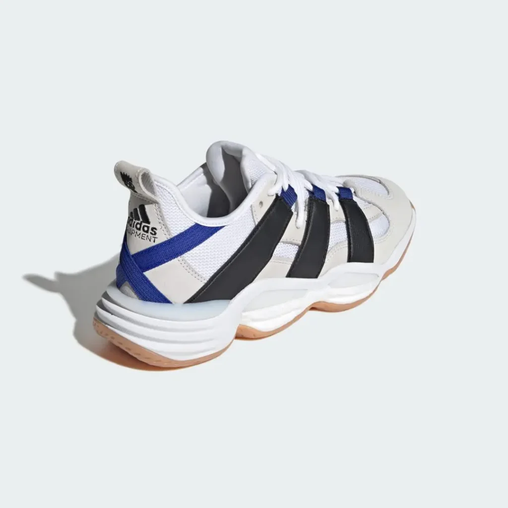 Angled rear view of the blue colorway’s forefoot showing textured mesh toe box, synthetic overlays, and oversized white stripe construction