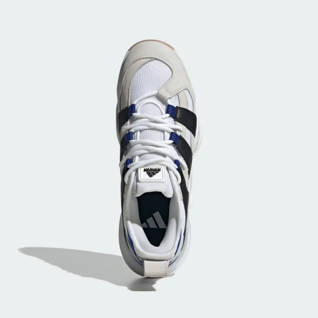 Close-up of the blue Adidas Equipment outsole displaying circular traction pattern, gum rubber tread, and visible Boost cushioning section