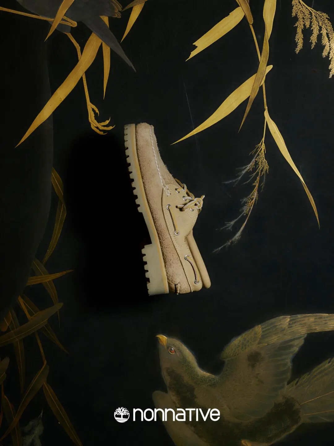 Editorial campaign image of the Timberland x nonnative 3EYE CLASSIC TAUPE suspended against a dark artwork-inspired backdrop featuring birds, foliage, and gold-toned botanical detail