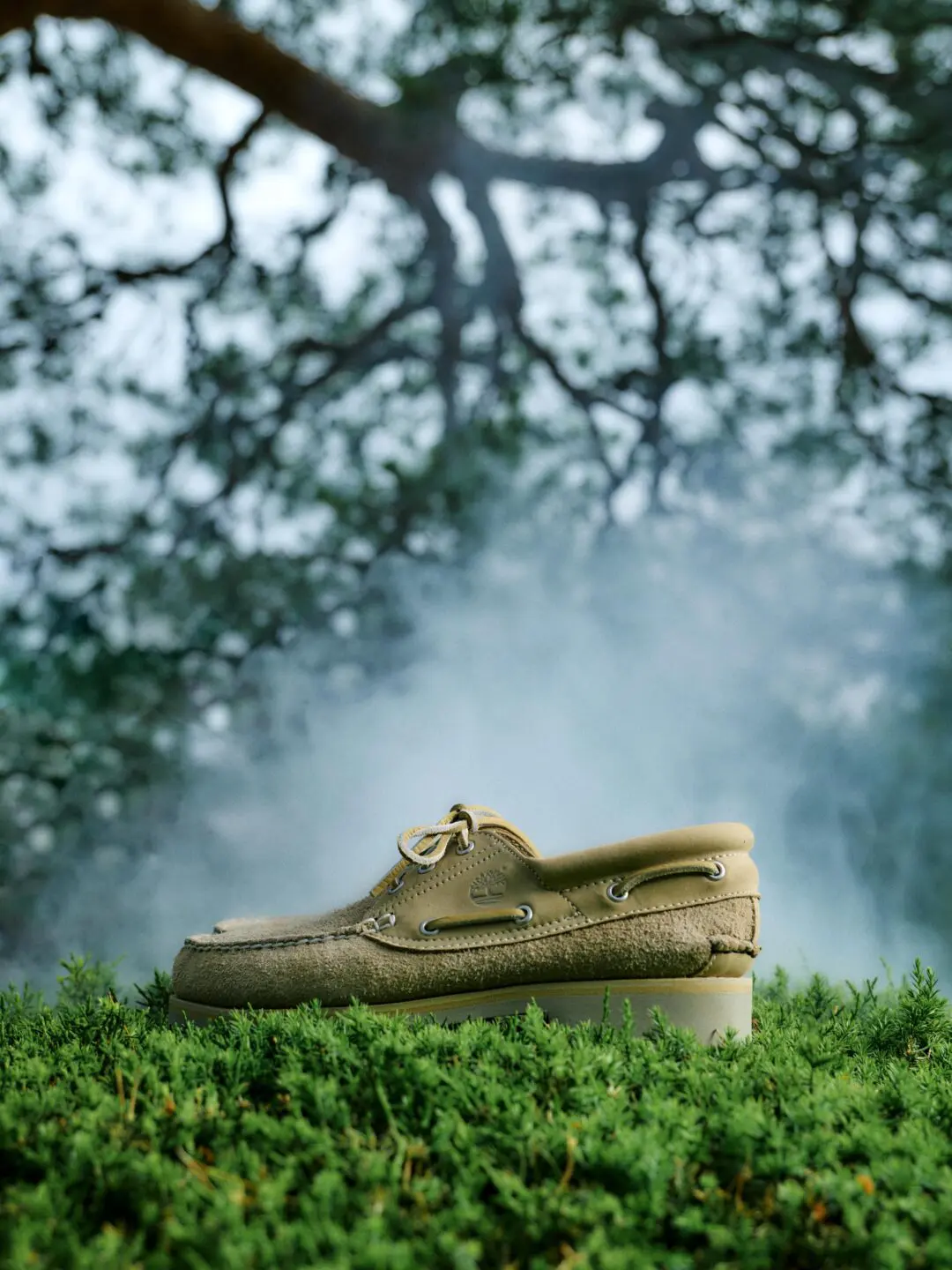 Timberland x nonnative 3EYE CLASSIC TAUPE displayed outdoors on lush greenery, highlighting the textured hairy suede upper and rugged lug sole