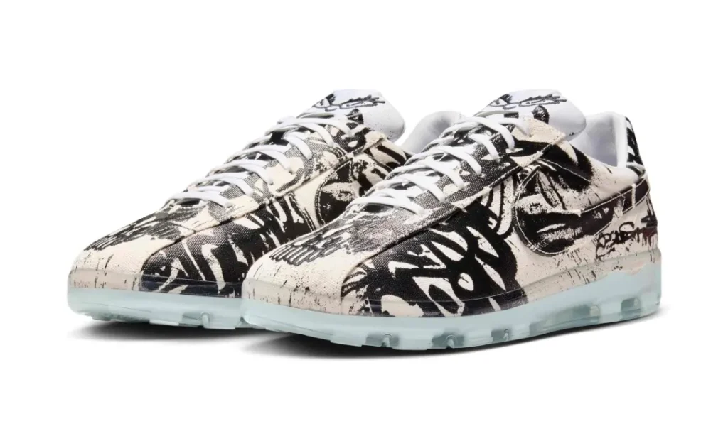 Pair of Nike Cryoshot sneakers featuring black-and-white graffiti artwork across a canvas upper with translucent icy-blue sole