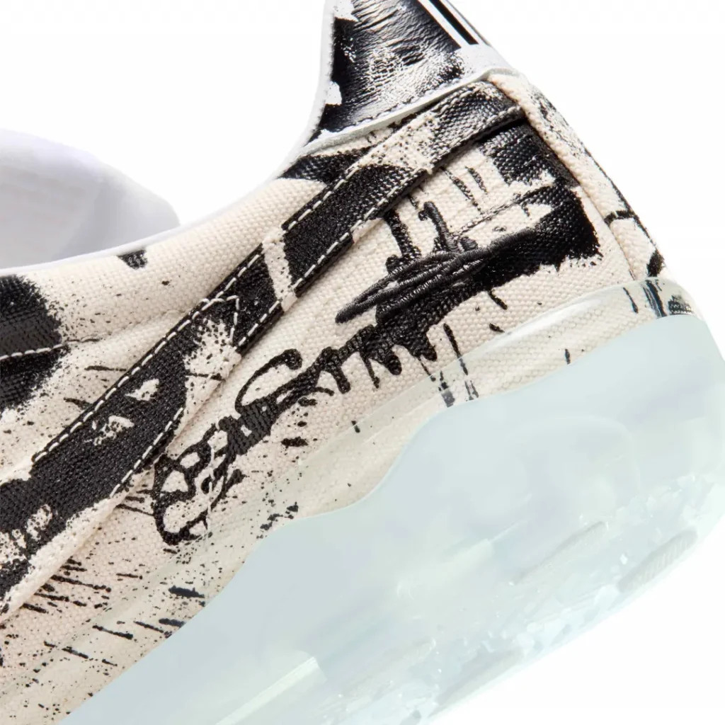 Detailed heel shot featuring embroidered artist signature graphics and a semi-transparent Cryoshot sole