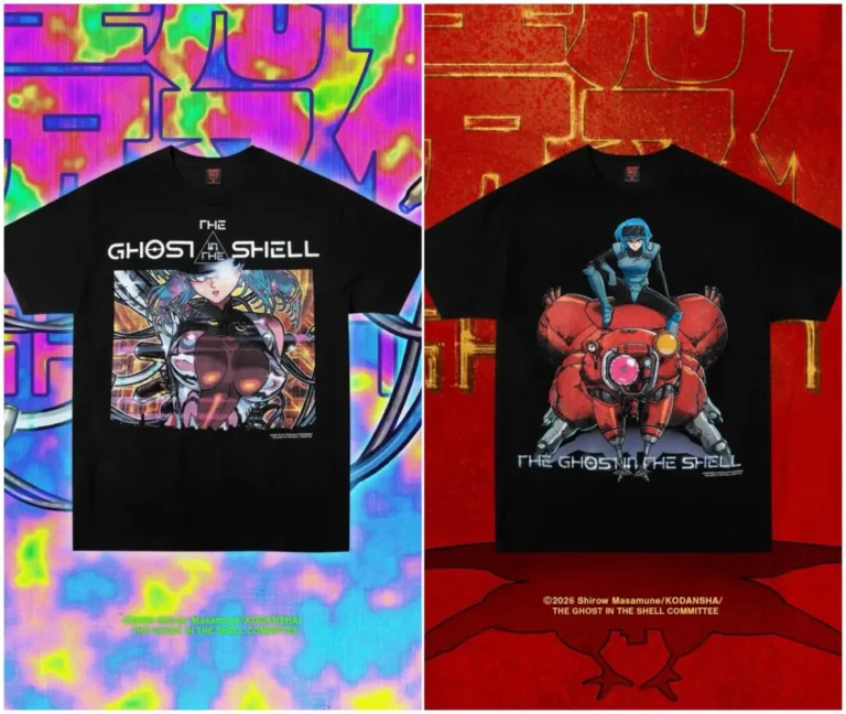 Two black Ghost in the Shell graphic T-shirts are displayed side by side. One features a futuristic cybernetic character surrounded by cables and neon circuitry, while the other shows a blue-haired character seated atop a red spider-like tank. Vibrant cyberpunk-inspired backgrounds frame both design