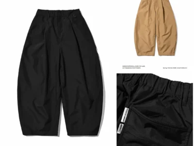 Black CLESSTE x +phenix CITY MASSIVE UTILITY PANTS displayed alongside a beige colorway, featuring oversized balloon-leg construction and WINDSTOPPER by GORE-TEX LABS brand