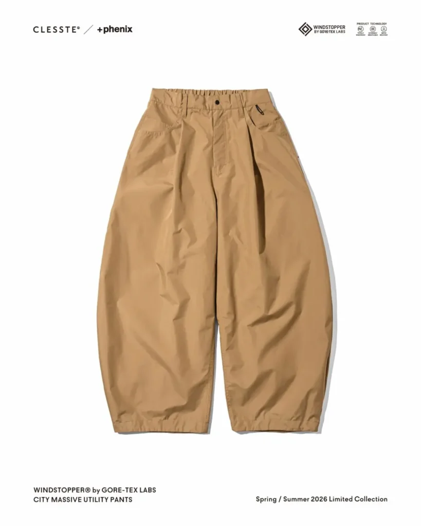 Front view of beige CLESSTE x +phenix CITY MASSIVE UTILITY PANTS with oversized balloon shape, elastic waist, and technical WINDSTOPPER construction
