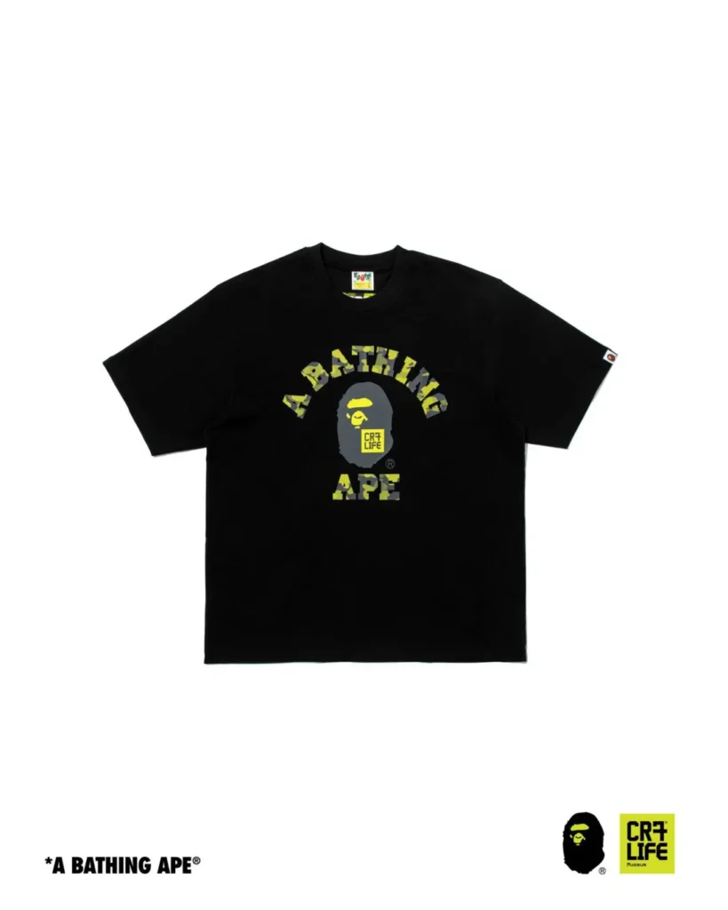 Black A BATHING APE x CR7 LIFE T-shirt showcasing the iconic APE HEAD logo surrounded by camouflage-inspired A Bathing Ape text across the chest