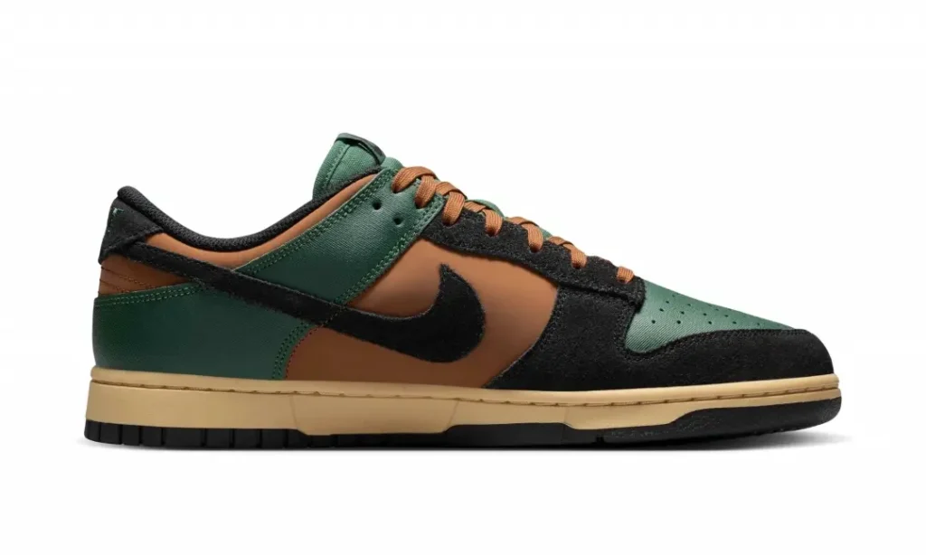 Lateral side view of the green and brown Nike Dunk Low featuring forest green toe and heel panels, brown quarter panels, black suede overlays, black Swoosh, and vintage cream mid