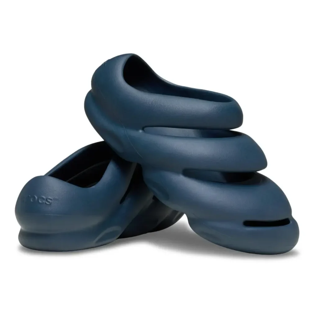 Crocs THE ROY "Nightfall" displayed as a stacked pair, highlighting the futuristic molded foam silhouette, oversized cushioned structure, and deep navy colorway designed by Steven Smith