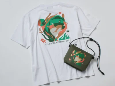 Barbour x Fuji Rock Festival ’26 collection featuring a white graphic T-shirt and matching olive sacoche bag displayed together, showcasing the festival’s colorful artwork inspired by nature and music