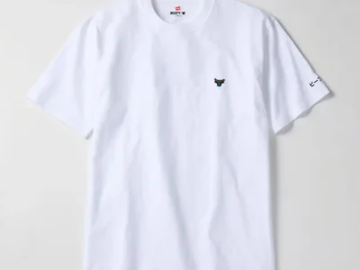 White Hanes BEEFY crew-neck T-shirt photographed against a clean white background. The minimalist design features a small embroidered bull-head logo on the chest and Japanese “BEEFY” lettering printed on the sleeve