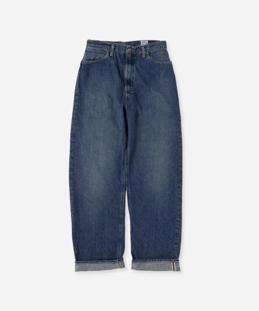 Dark-wash relaxed-fit denim jeans with subtle fading, cuffed hems, and a timeless workwear-inspired design