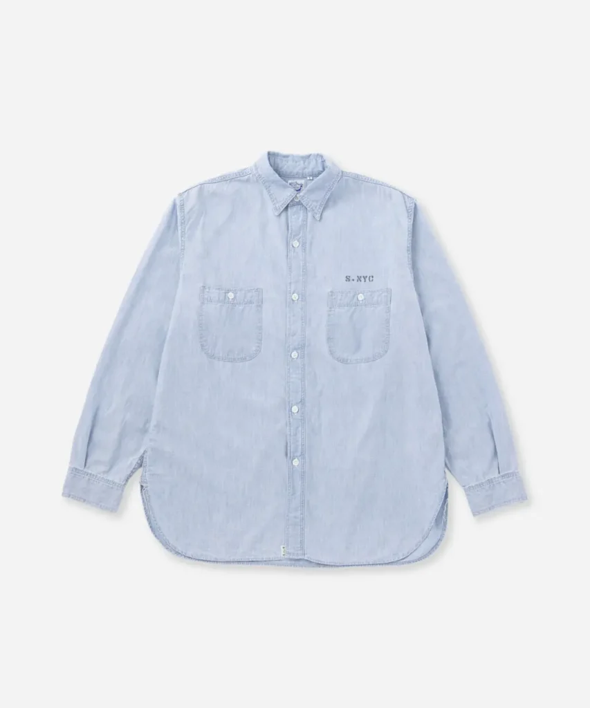 Light indigo chambray button-down shirt from Saturdays NYC featuring dual chest pockets, subtle logo embroidery, and a relaxed fit