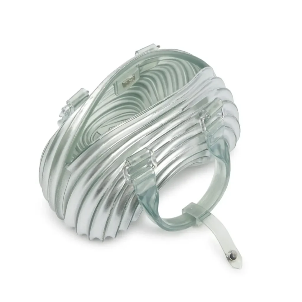Open-top view of the translucent Melissa × Diesel handbag, highlighting the molded interior, curved structure, and transparent carry handle