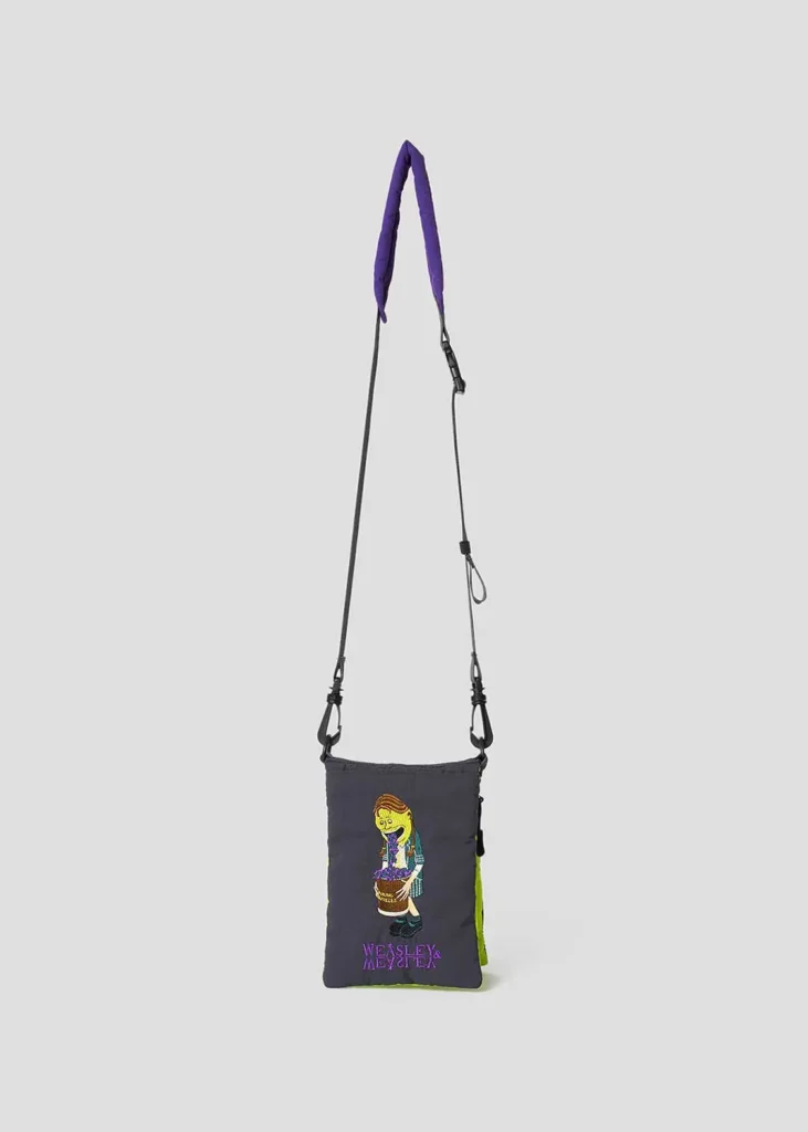 Small crossbody pouch in dark gray with lime green accents, embroidered with a Weasleys’ Wizard Wheezes-inspired character graphic and logo