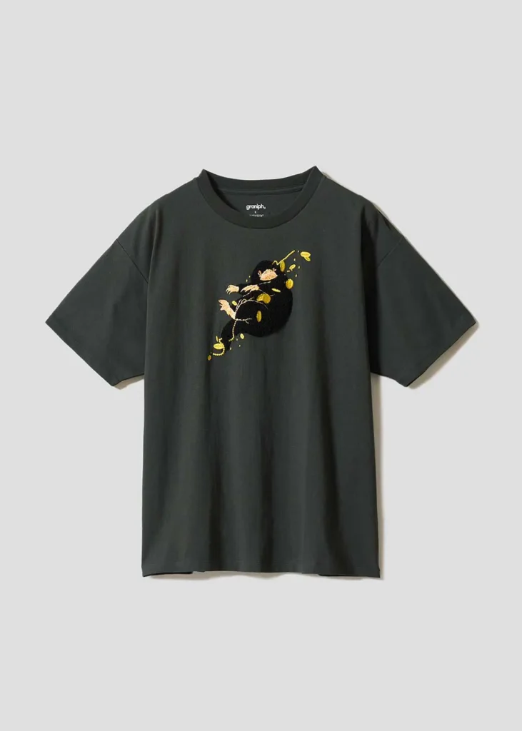 Dark charcoal oversized T-shirt with a small embroidered Niffler graphic on the chest, surrounded by scattered gold coin detail