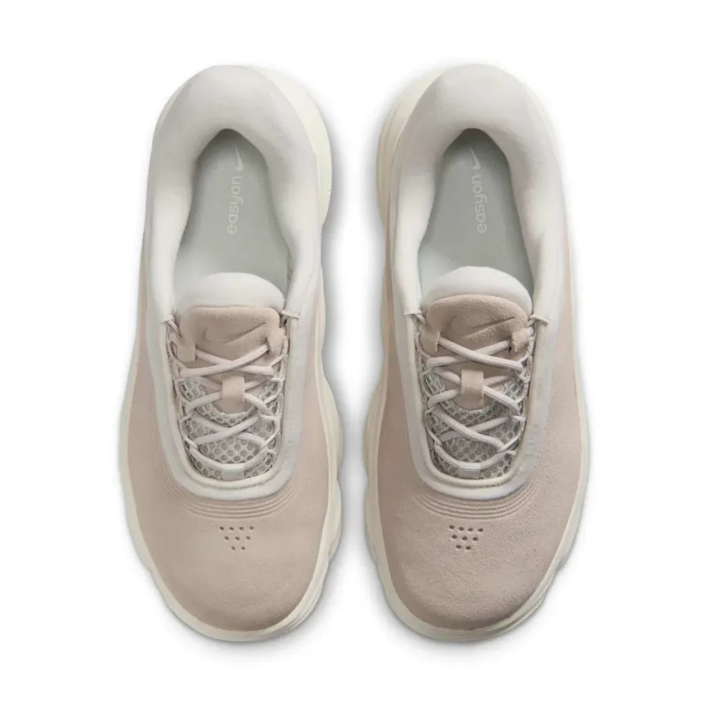 Top-down view of the Nike Motiva Suede revealing the padded interior, mesh lace area, suede tongue, and perforated toe detail